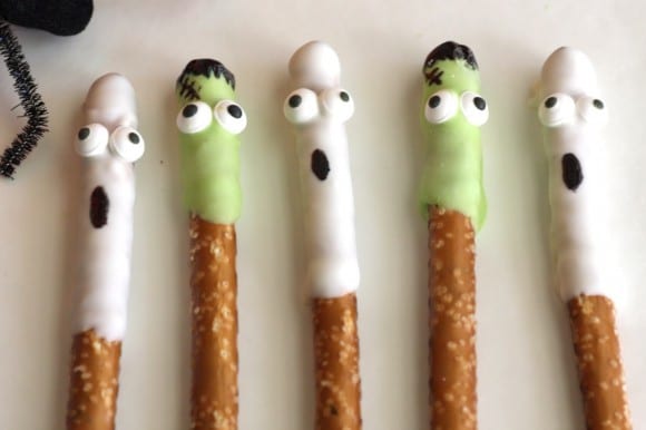 Halloween White Chocolate Covered Ghost and Frankenstein Pretzels | CatchMyParty.com